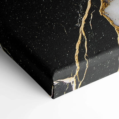 Black canvas art with gold and white abstract veins and speckled details on textured canvas surface.