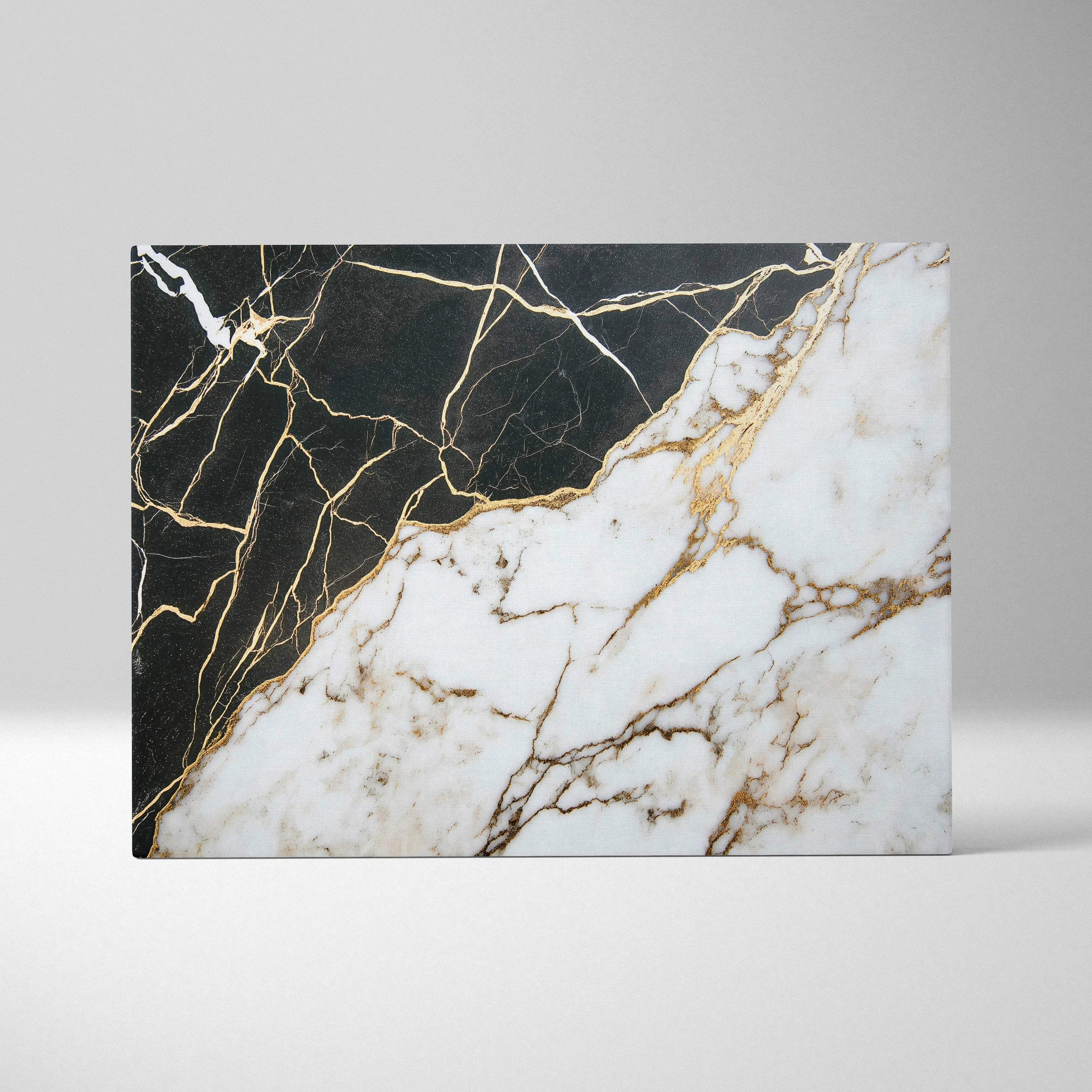 Abstract canvas art with black and white marble textures intersected by gold veining.