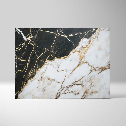 Abstract canvas art with black and white marble textures intersected by gold veining.