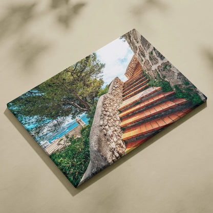 Canvas wall art featuring vibrant digital artwork of terracotta stairs with stone walls and greenery under a bright blue sky.