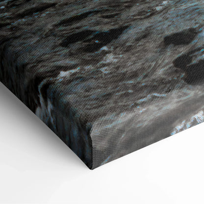 Close-up of textured canvas wall art showing dark turquoise waterfall scene with flowing water details and nature elements.