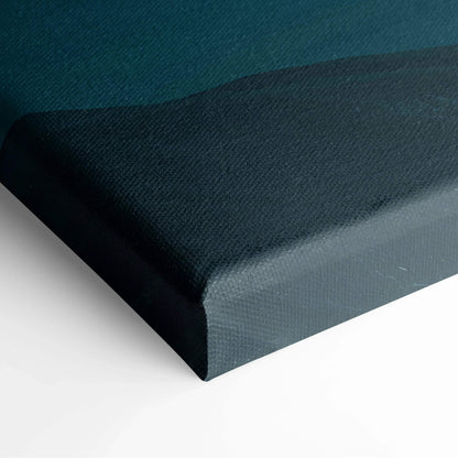 Close-up of modern minimalist digital mountain landscape art on stretched canvas wall decor with dark blue and black tones.