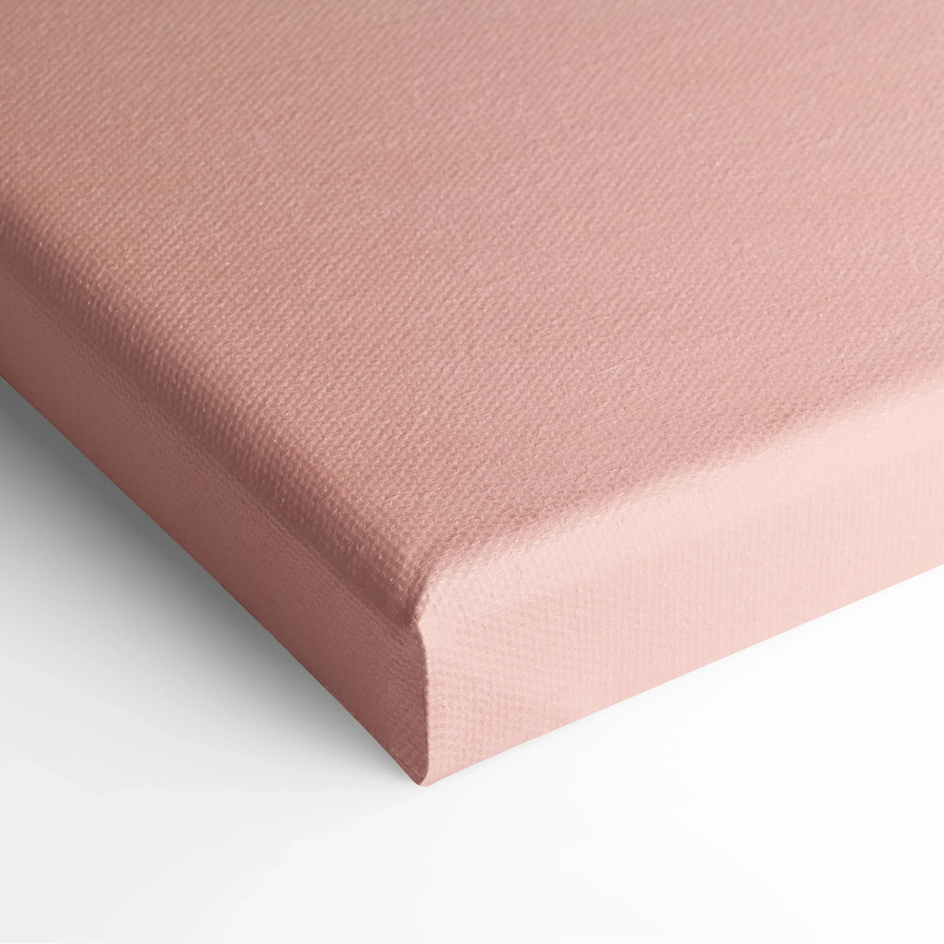 Close-up of pink textured canvas corner showcasing minimalist wall art decor.