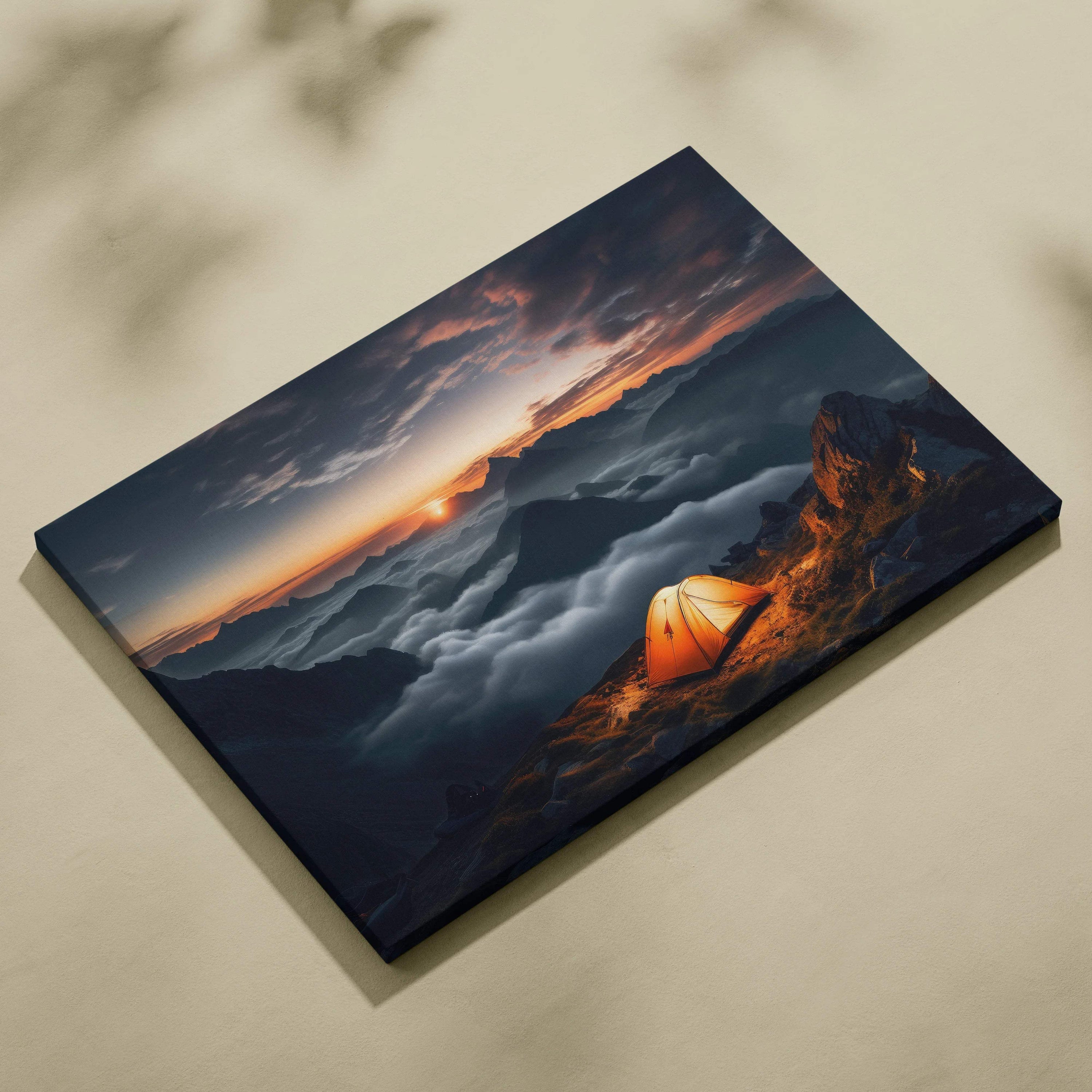 Canvas print of orange tent camping on mountain summit over clouds at sunset
