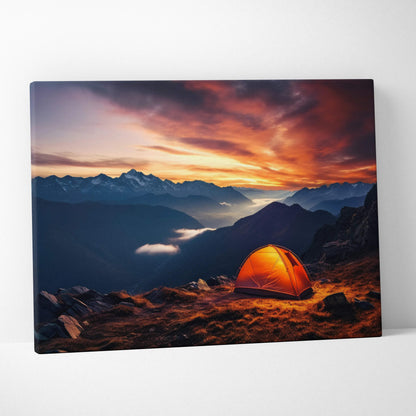 Orange dome tent on mountain peak at dusk with sunset orange purple sky