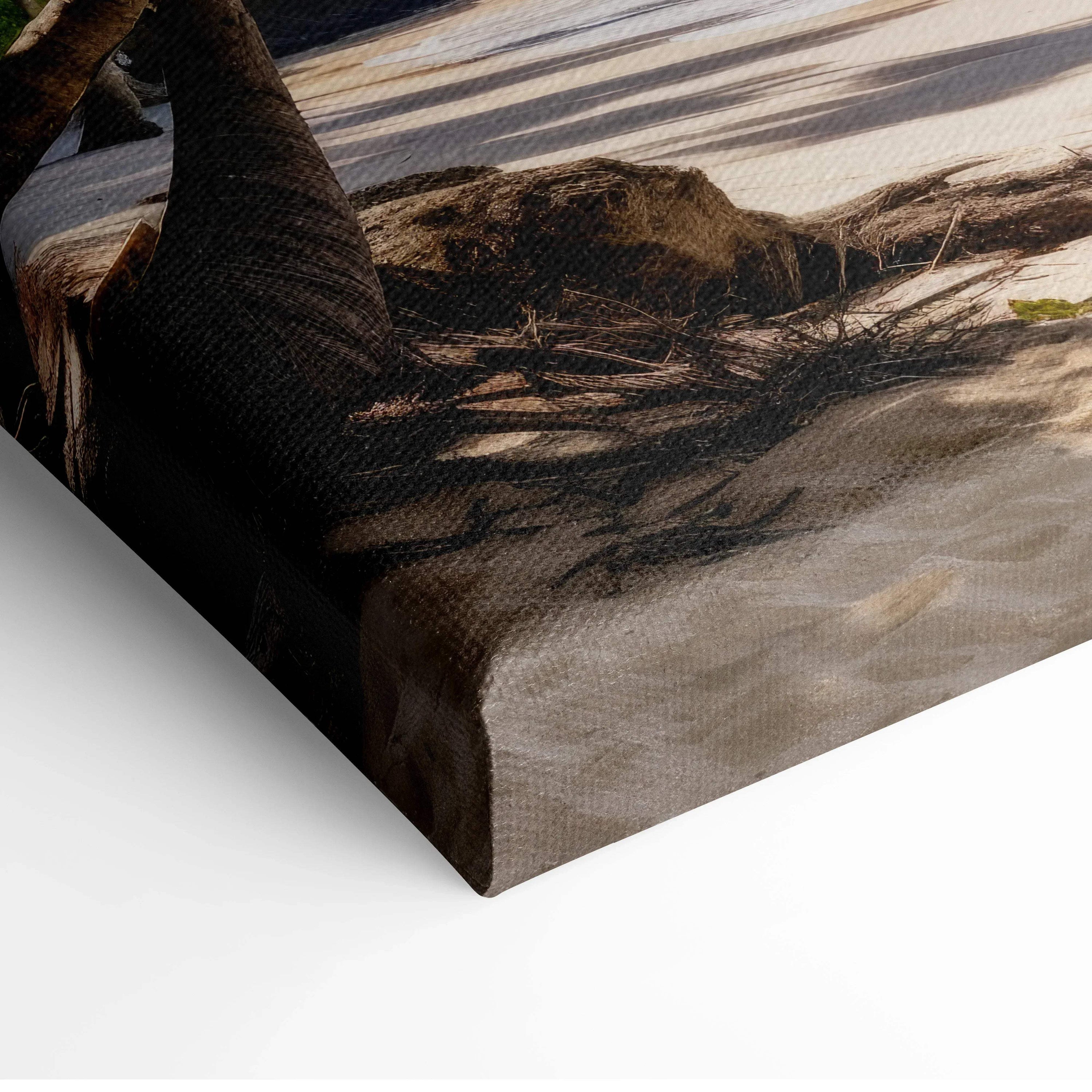 Canvas wall art featuring a shadowed beach scene with sand and a palm tree trunk in warm, muted tones.