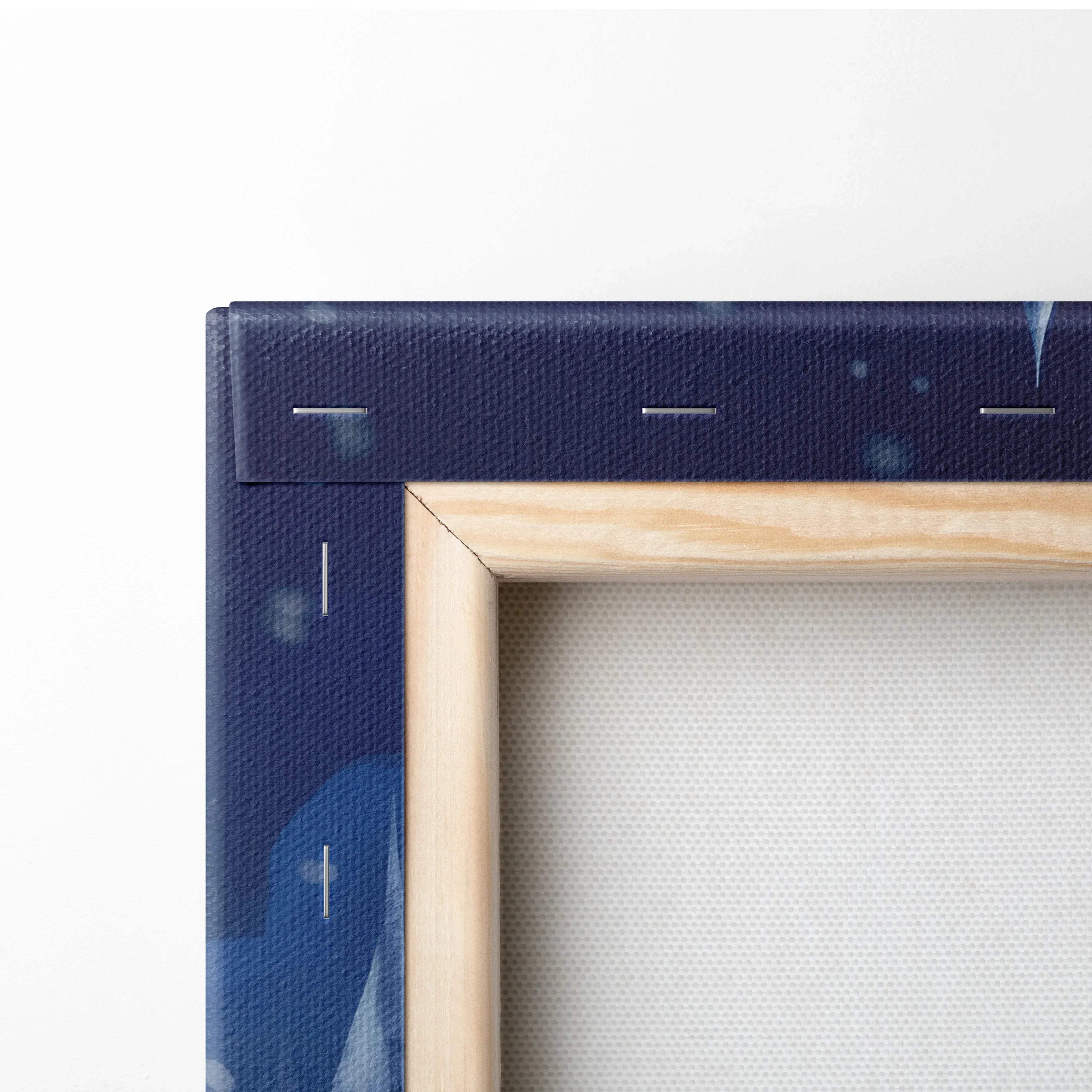 Close-up of corner showing blue snowy winter-themed digital canvas art print with wooden frame and visible canvas texture.