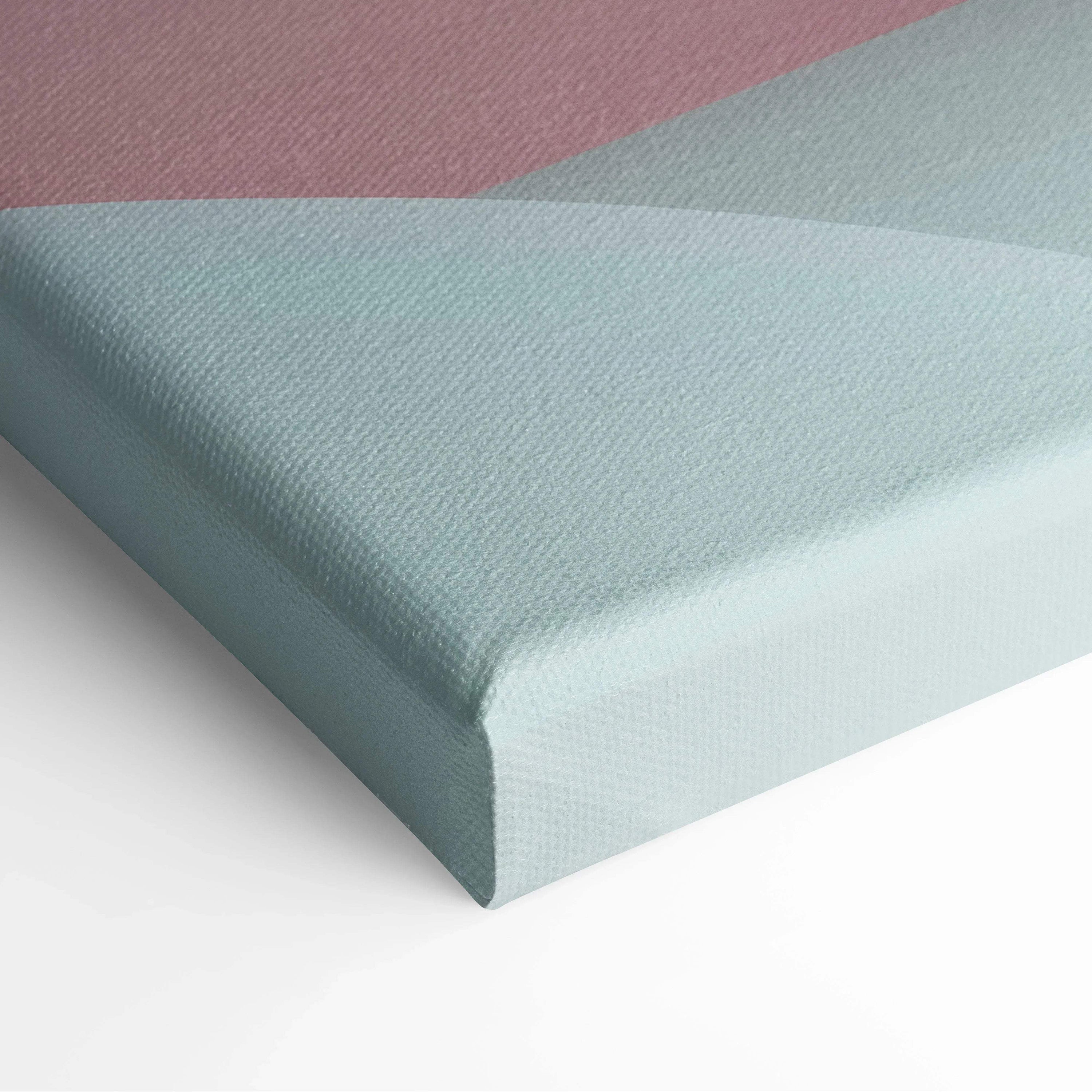 Close-up of a canvas art corner with soft pastel shades of pink, gray, and light blue in an abstract geometric design.