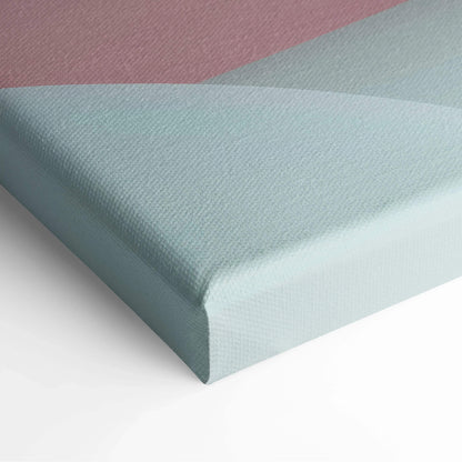 Close-up of a canvas art corner with soft pastel shades of pink, gray, and light blue in an abstract geometric design.