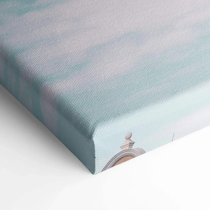 Close-up of canvas wall art with soft pastel blue and green tones, showing textured fabric and corner detail of.