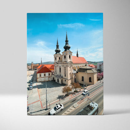 Vertical canvas wall art of iconic historic church with twin spires against blue sky.
