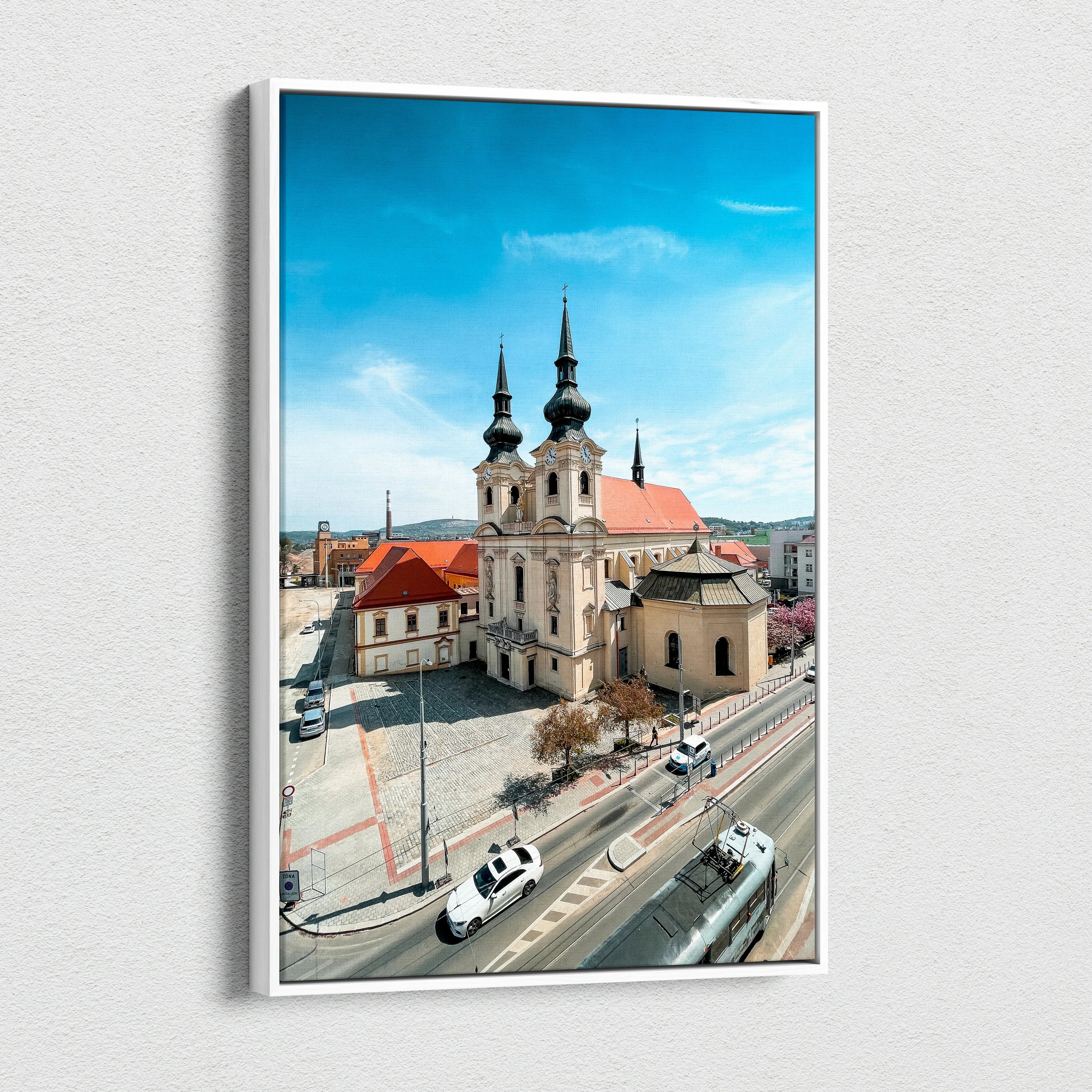 Vertical canvas art of historic church with twin spires against clear blue sky, urban wall art.