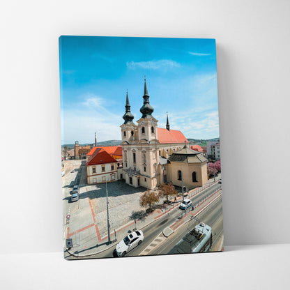 Canvas wall art featuring detailed urban architecture with twin-spired historic building under a blue sky.
