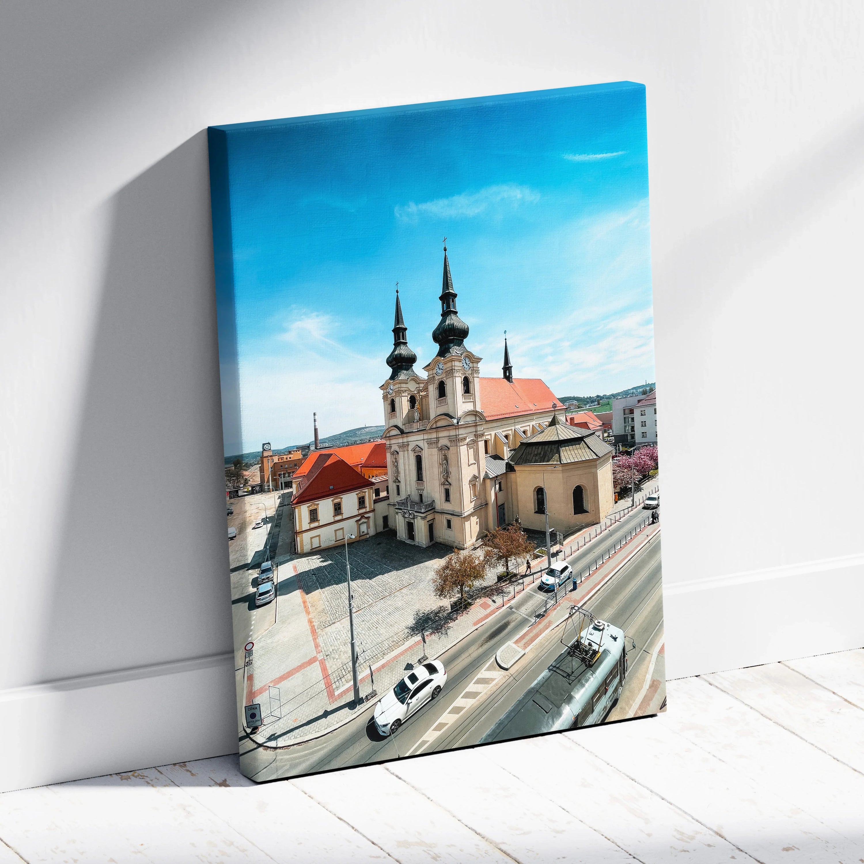 Vertical canvas art of historic urban church with red roofs under a blue sky wall art.