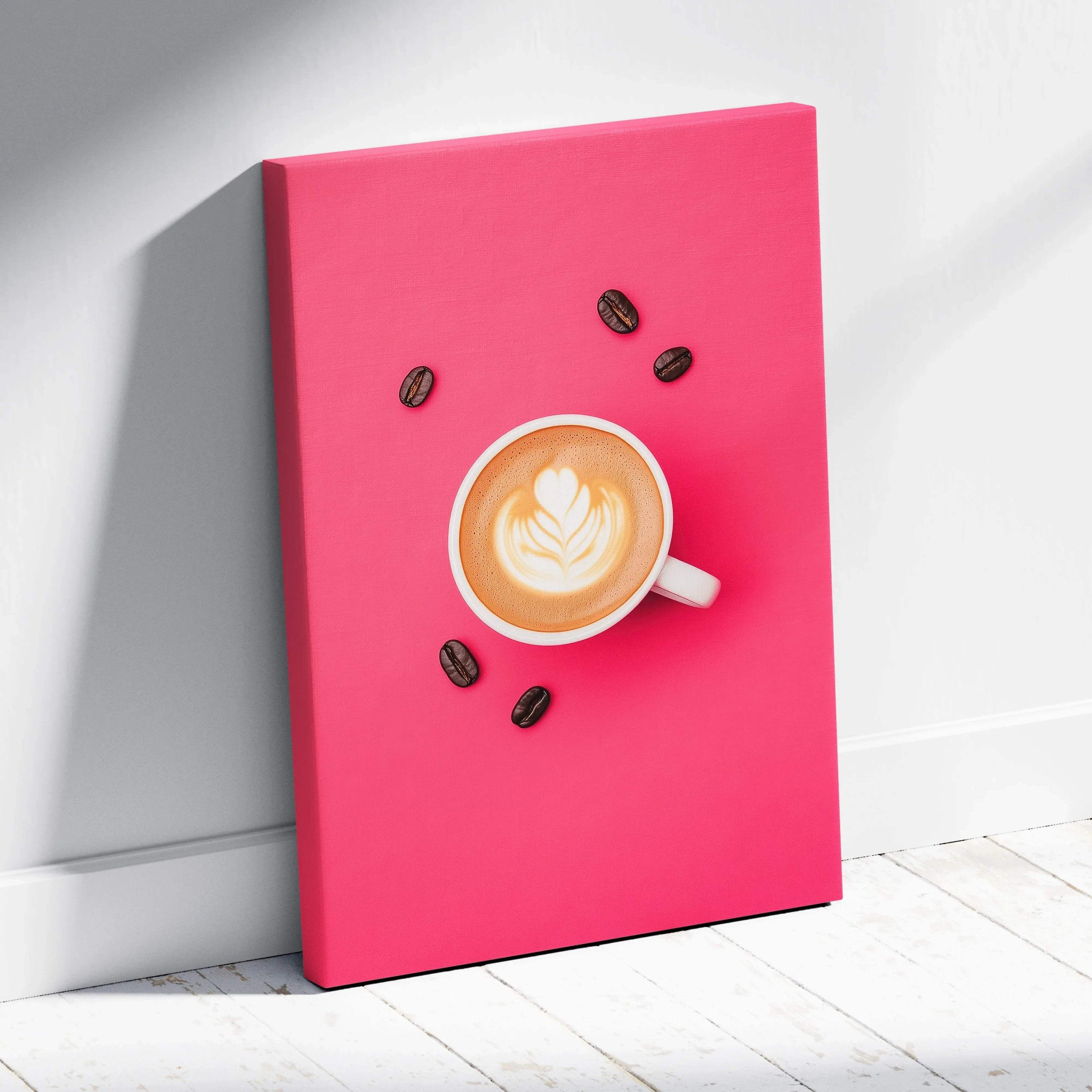 Canvas wall art featuring a steaming cup of latte with latte art, surrounded by coffee beans on a bright pink background.