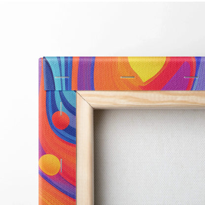 Abstract digital canvas wall art with vibrant geometric shapes in red, blue, yellow, and orange wrapped around wooden frame.