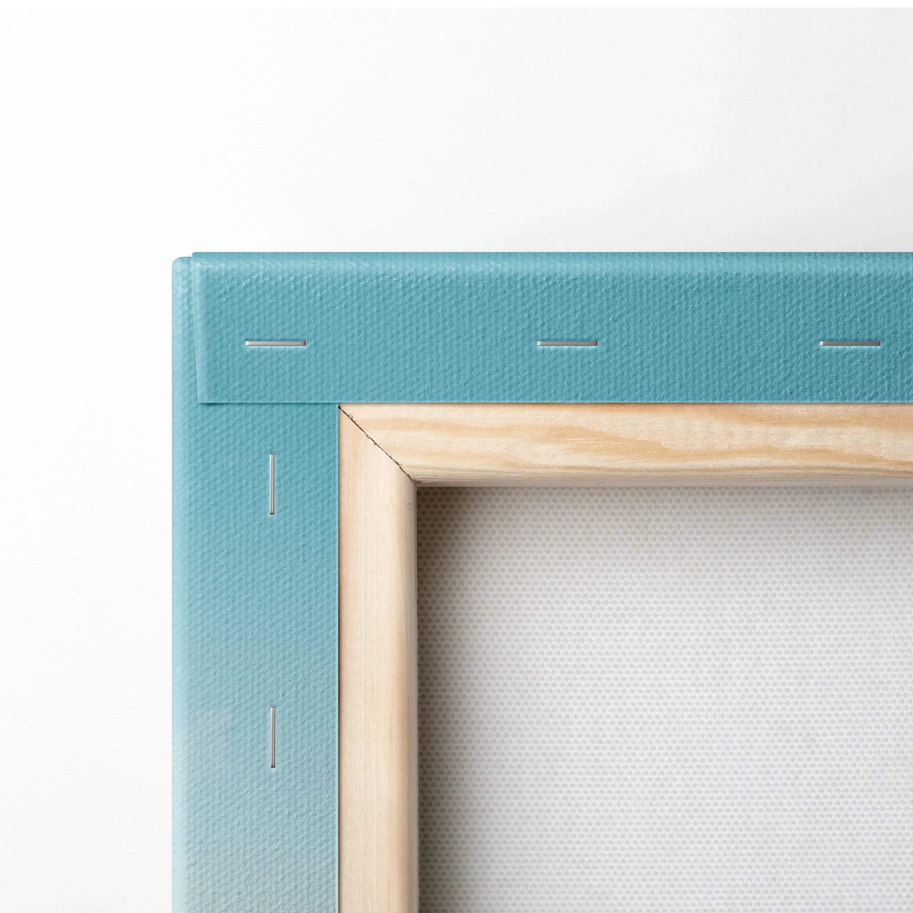Close-up of stretched canvas with blue edge and natural wood frame backing for wall art decor.