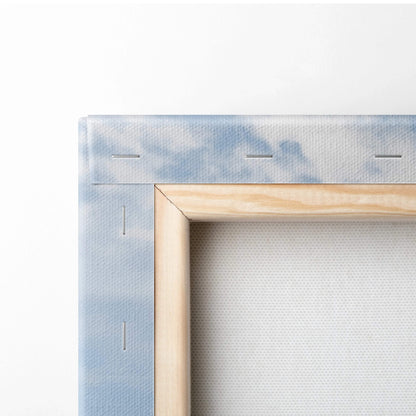 Light blue cloud-textured canvas of cows grazing in Dolomites meadow, wood frame