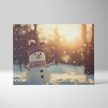 Canvas wall art featuring a cute snowy snowman with a red hat and scarf in a bright winter landscape.
