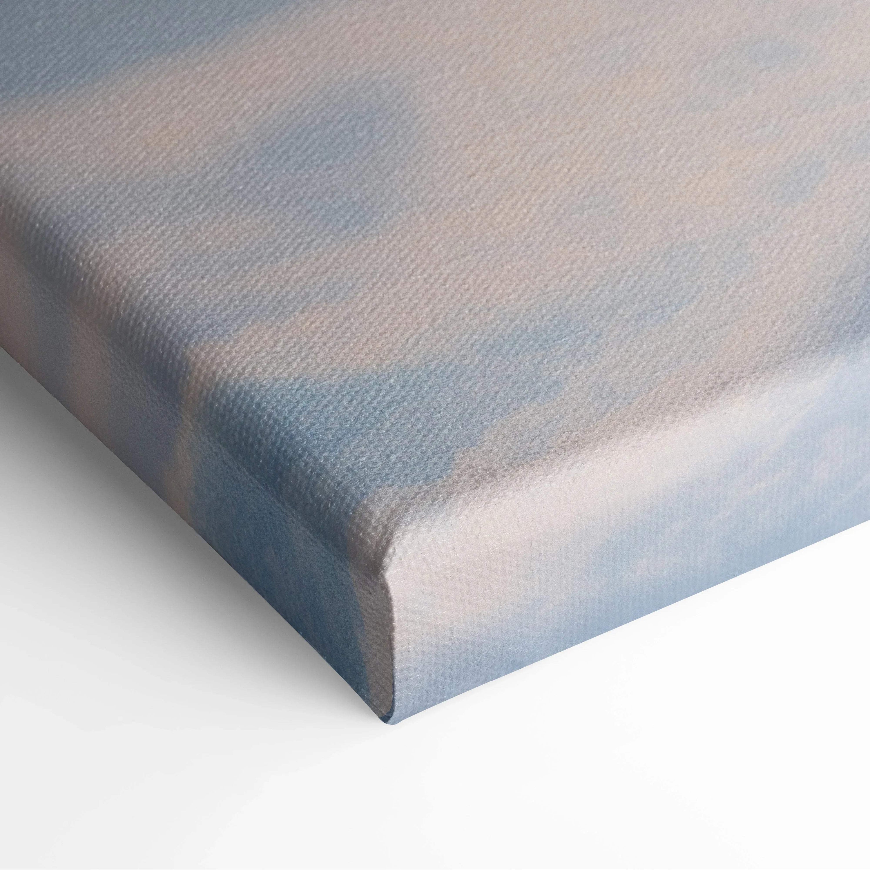 Wrapped canvas corner showing textured surface with soft blue and white snowy sky design.