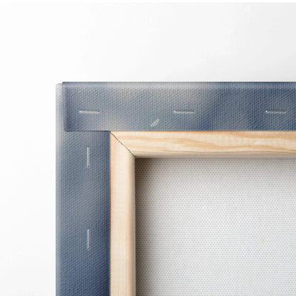 Close-up of stretched canvas corner with natural wood frame and dark blue fabric backing for wall art decor.