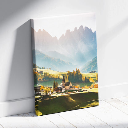 Canvas wall art print featuring a high-resolution digital landscape of mountains, village, and soft sunlight.
