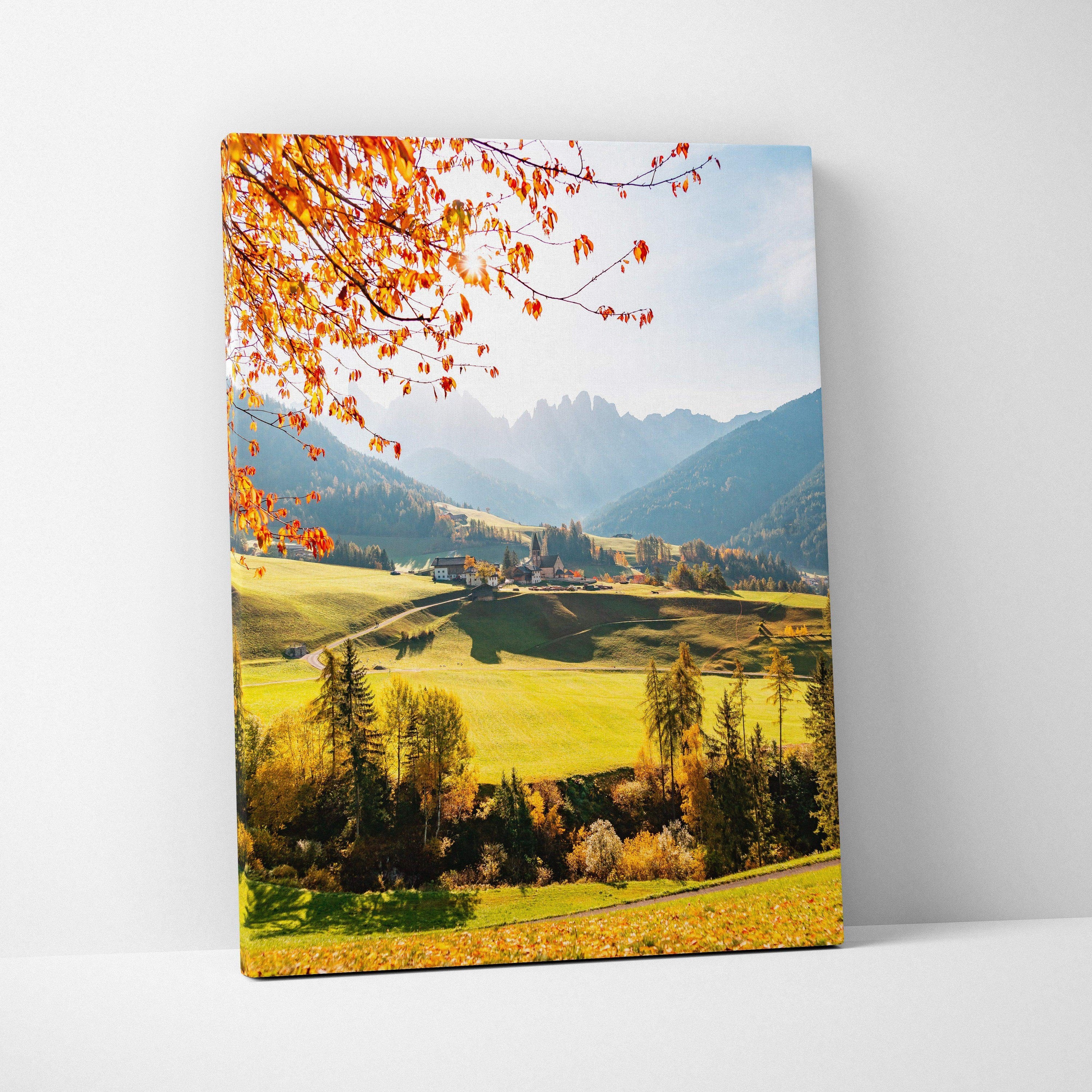 Vertical canvas wall art featuring vibrant autumn leaves over a sunlit mountain valley.