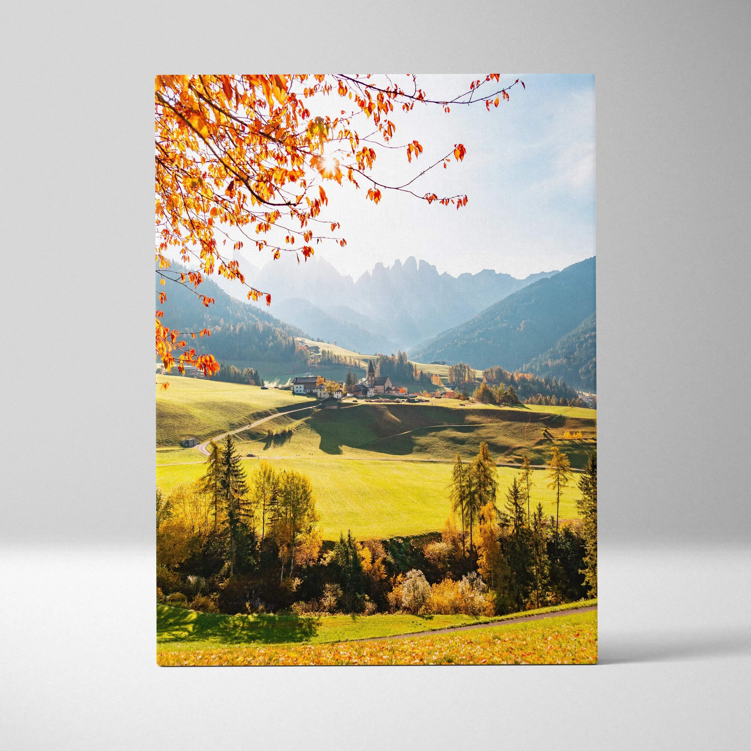 Canvas wall art featuring vibrant autumn leaves over a sunlit valley with distant mountains and blue sky.