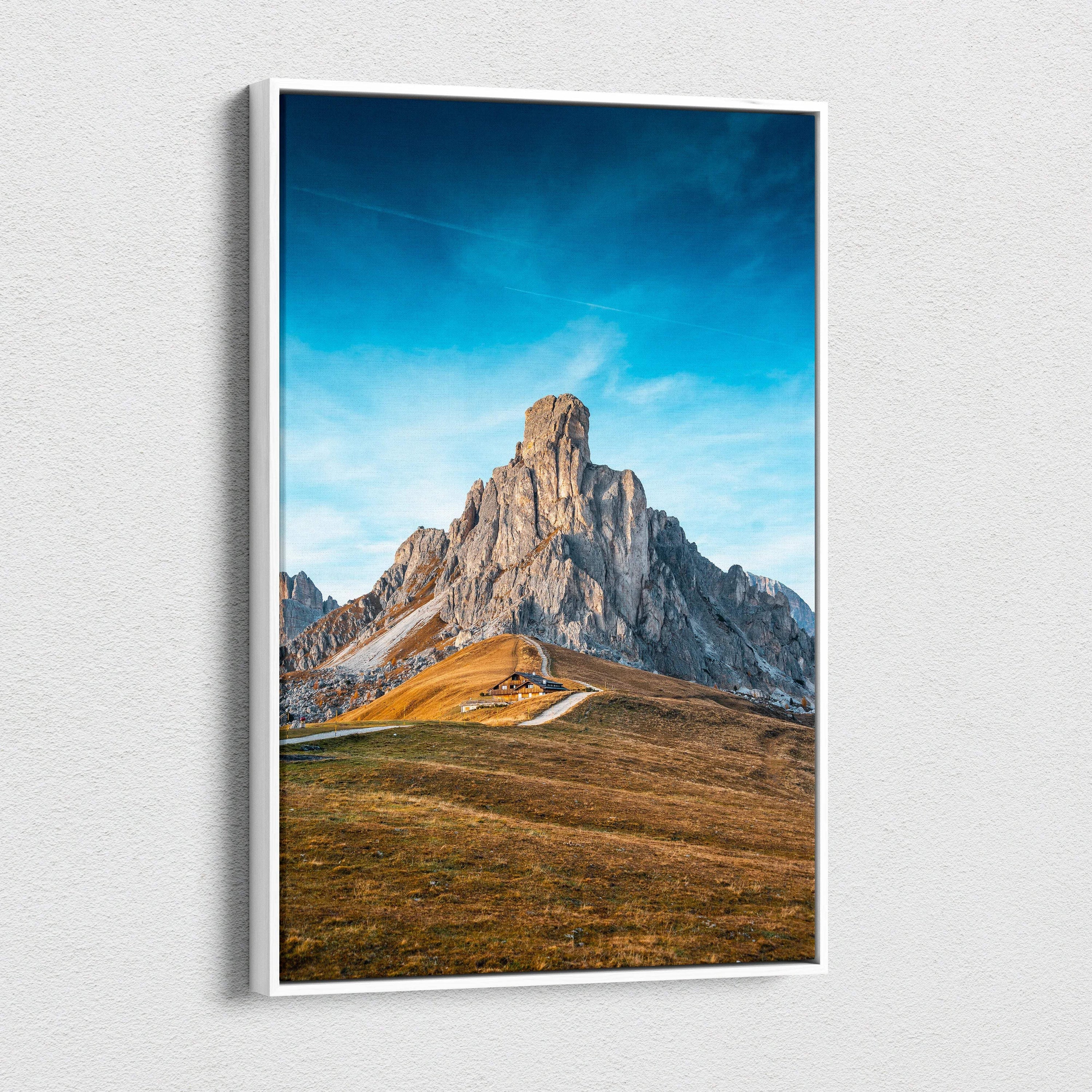 White-framed canvas of Ra Gusela Peak over Giau Pass serene blue sky