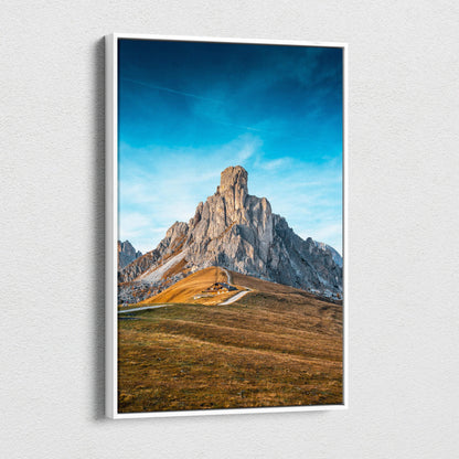 White-framed canvas of Ra Gusela Peak over Giau Pass serene blue sky