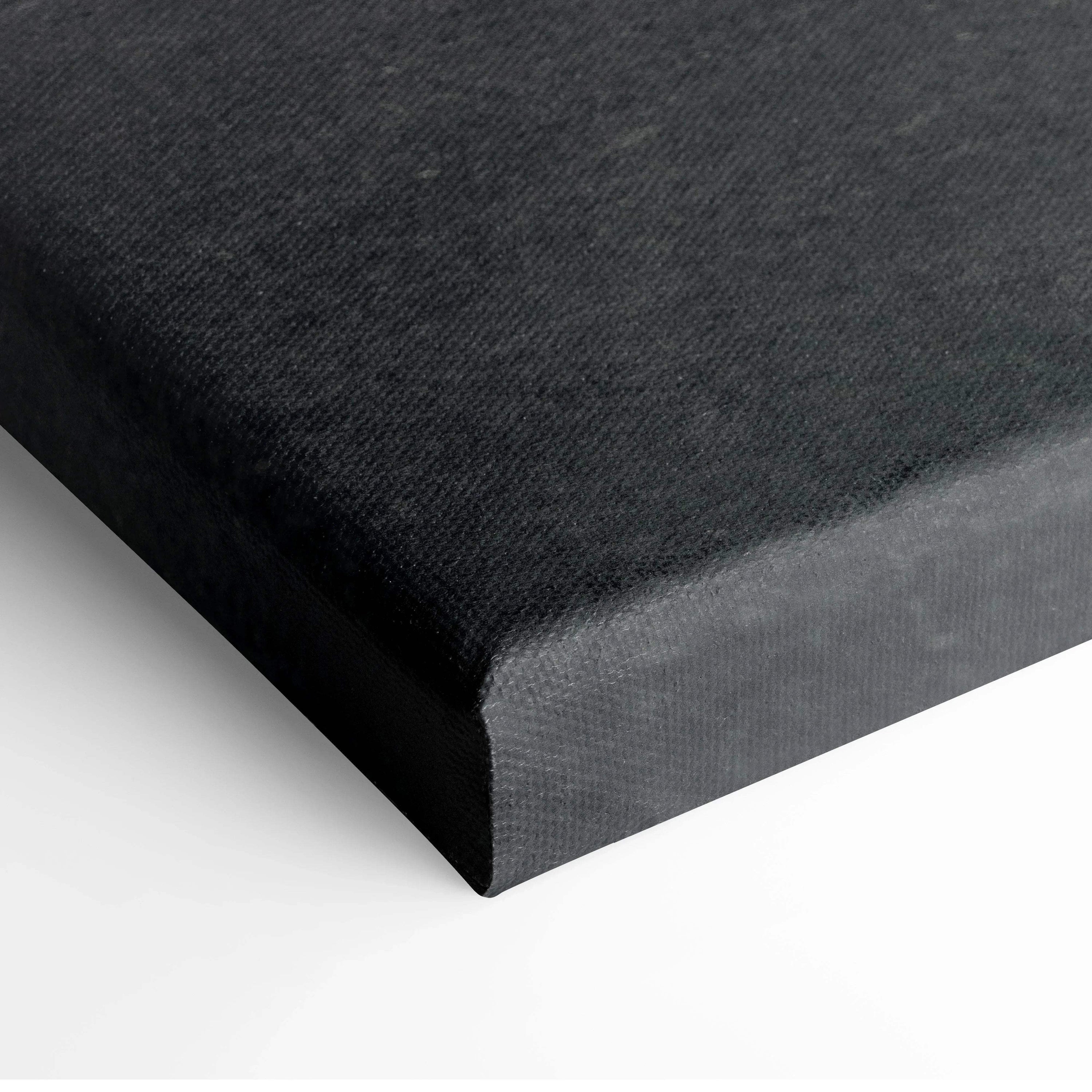 Close-up of black canvas stretched on wooden frame for wall art decor.