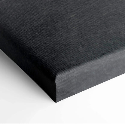 Close-up of black canvas stretched on wooden frame for wall art decor.