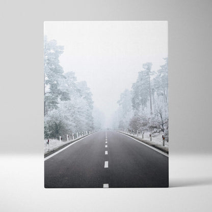 Serene winter road scene on canvas wall art with snowy trees and mist for home decor.