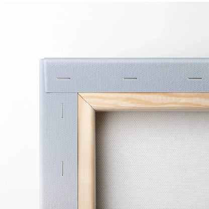 Close-up of wooden stretched canvas frame with white textured canvas for wall art decor.