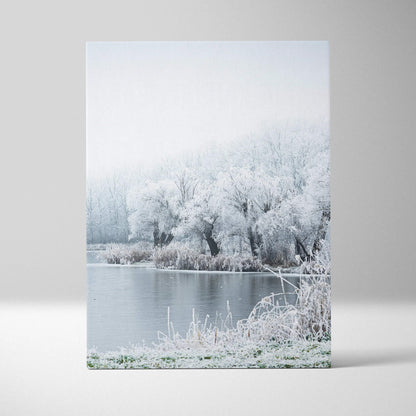 Winter landscape canvas wall art with snowy trees and a frozen lake in soft muted tones.