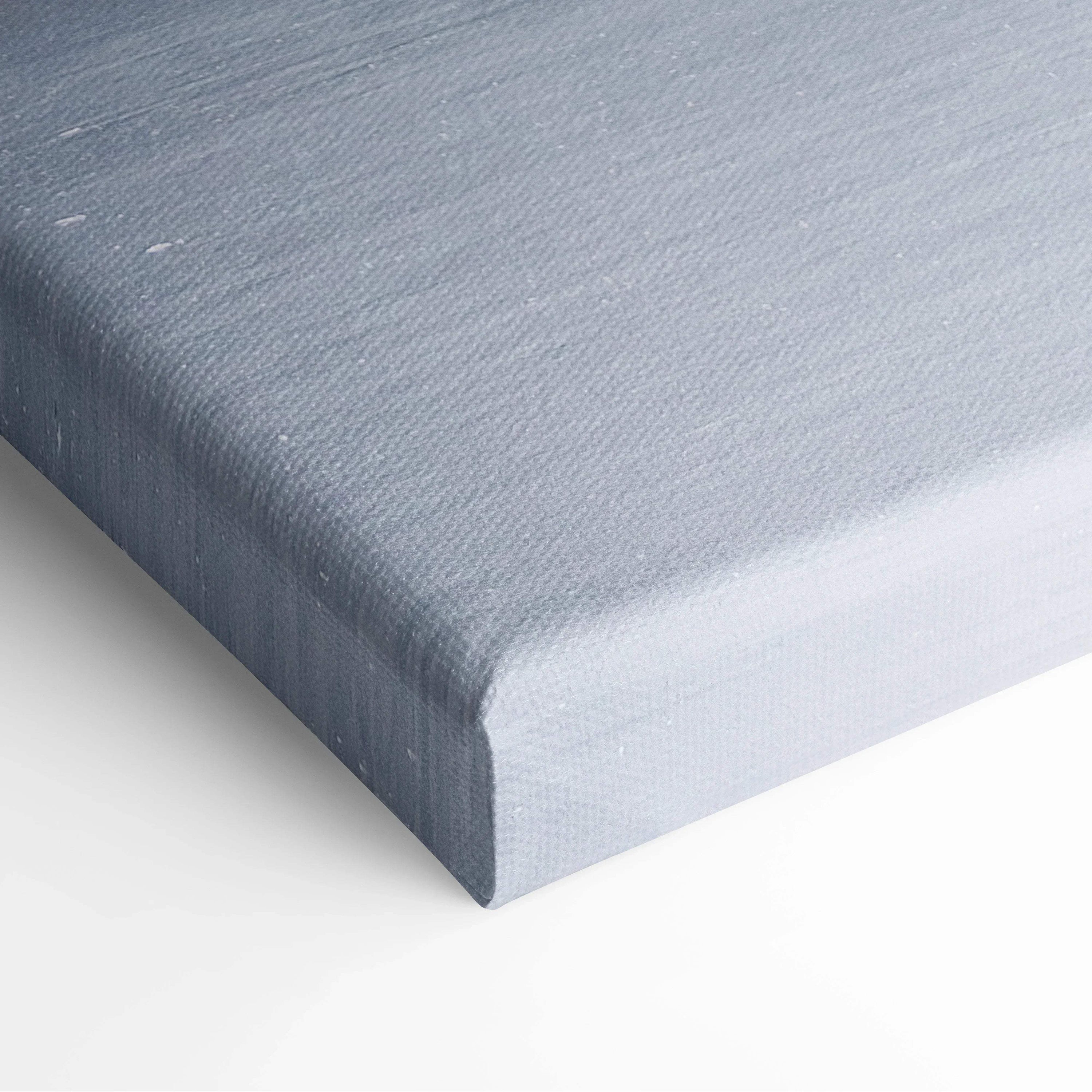 Close-up of textured gray canvas edge for digital winter snowy trees wall art decor.