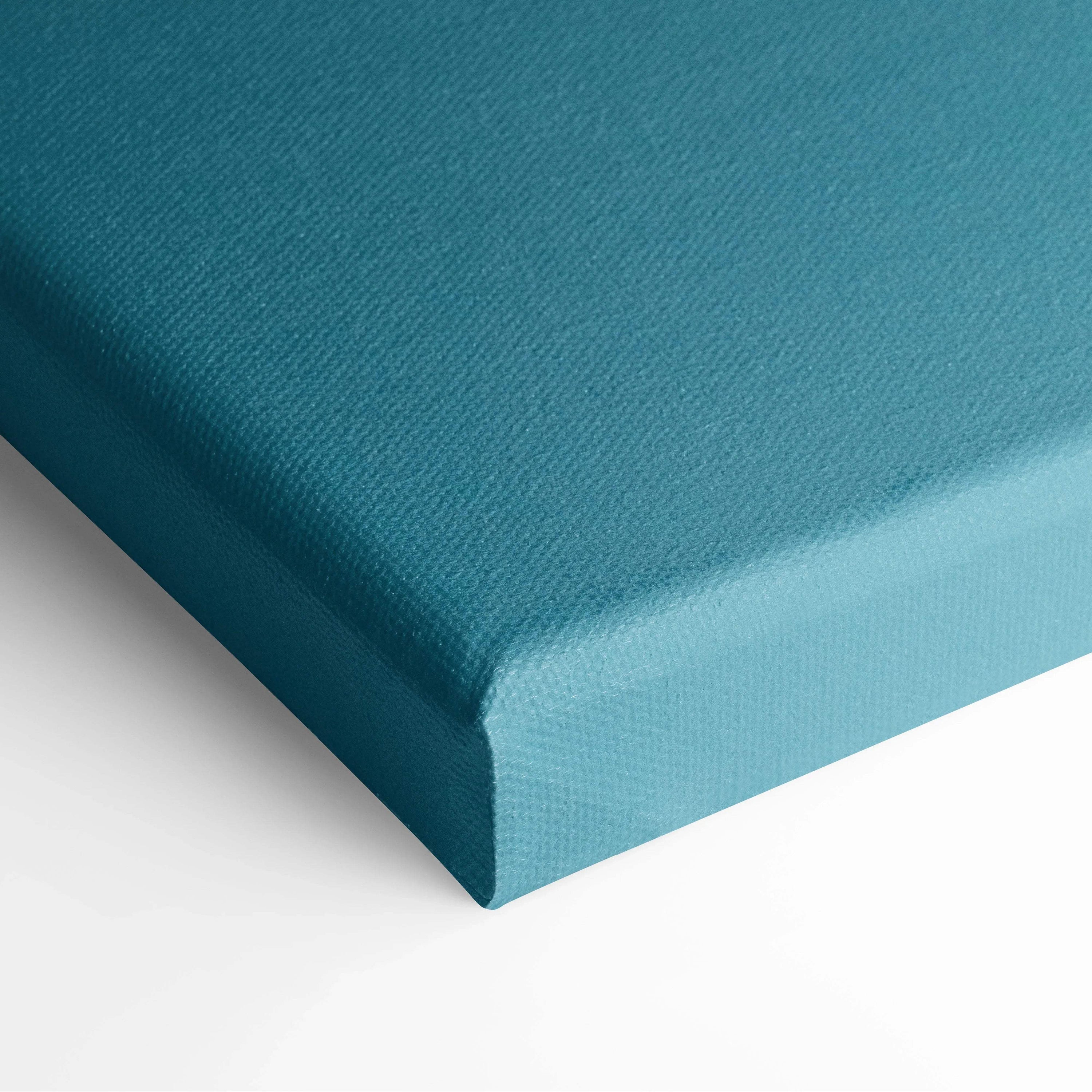 Teal canvas wall art close-up showing textured fabric and wrapped edges for elegant decor.