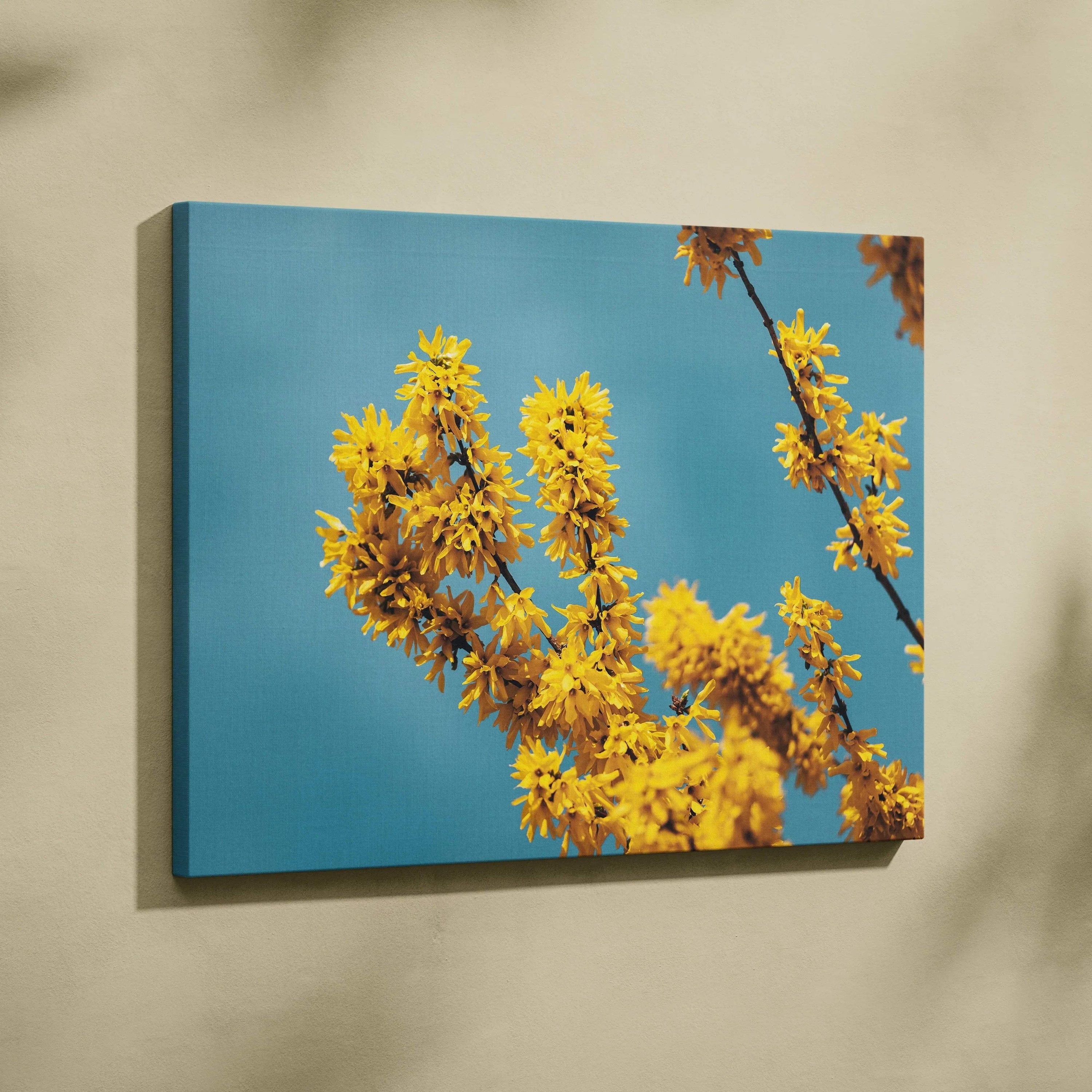 Cherry blossom canvas wall art with yellow flowers against blue sky, elegant home decor.