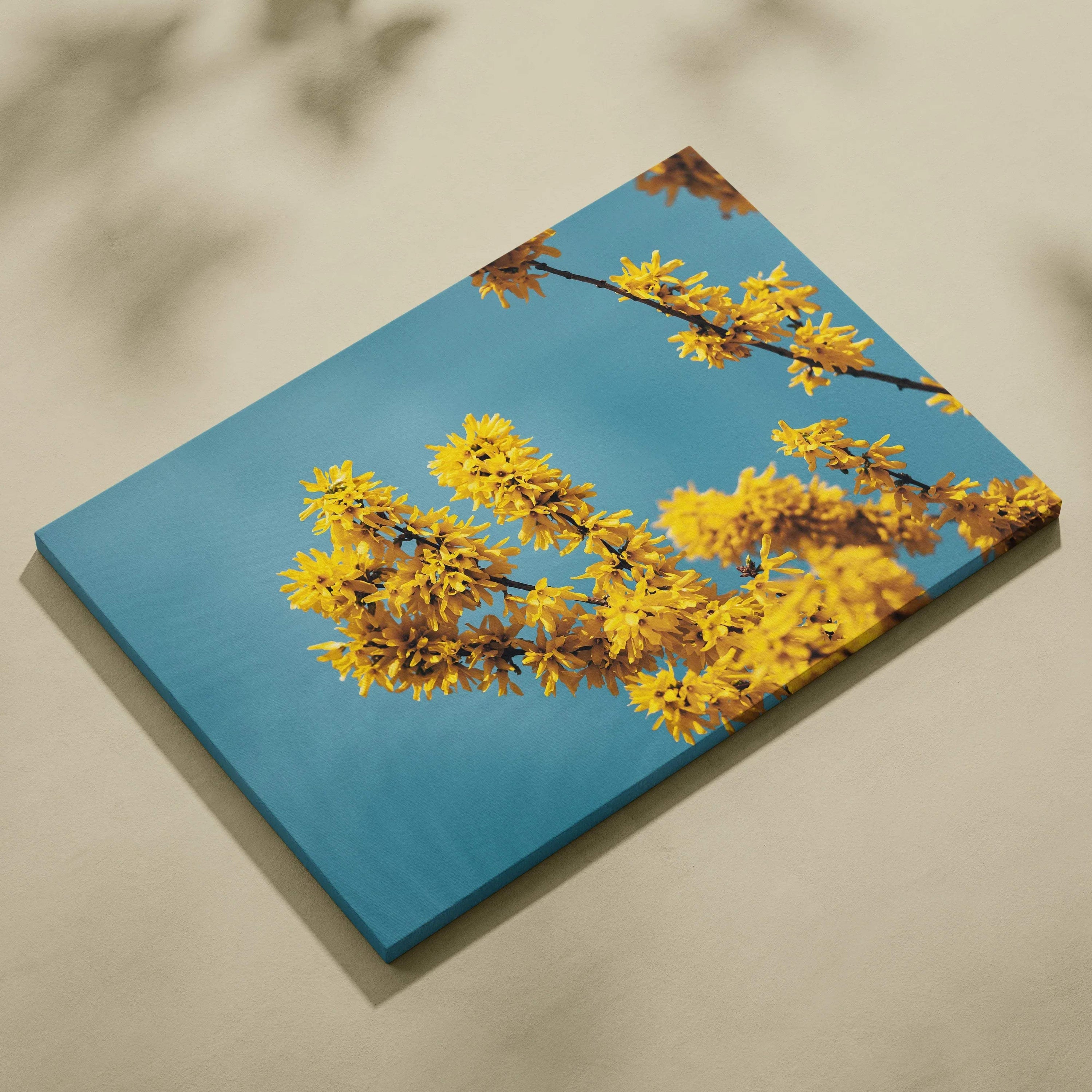 Canvas wall art featuring vibrant yellow cherry blossoms against a clear blue sky for elegant decor.