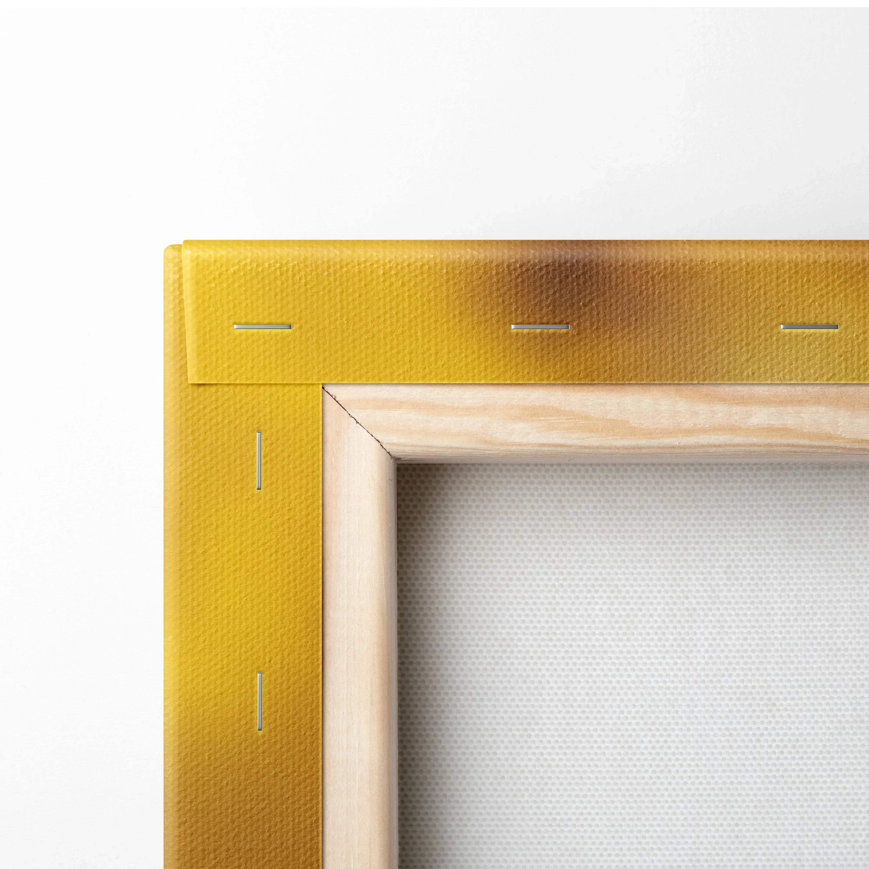 Close-up of wooden stretcher frame and canvas corner with yellow edge for wall art decor.