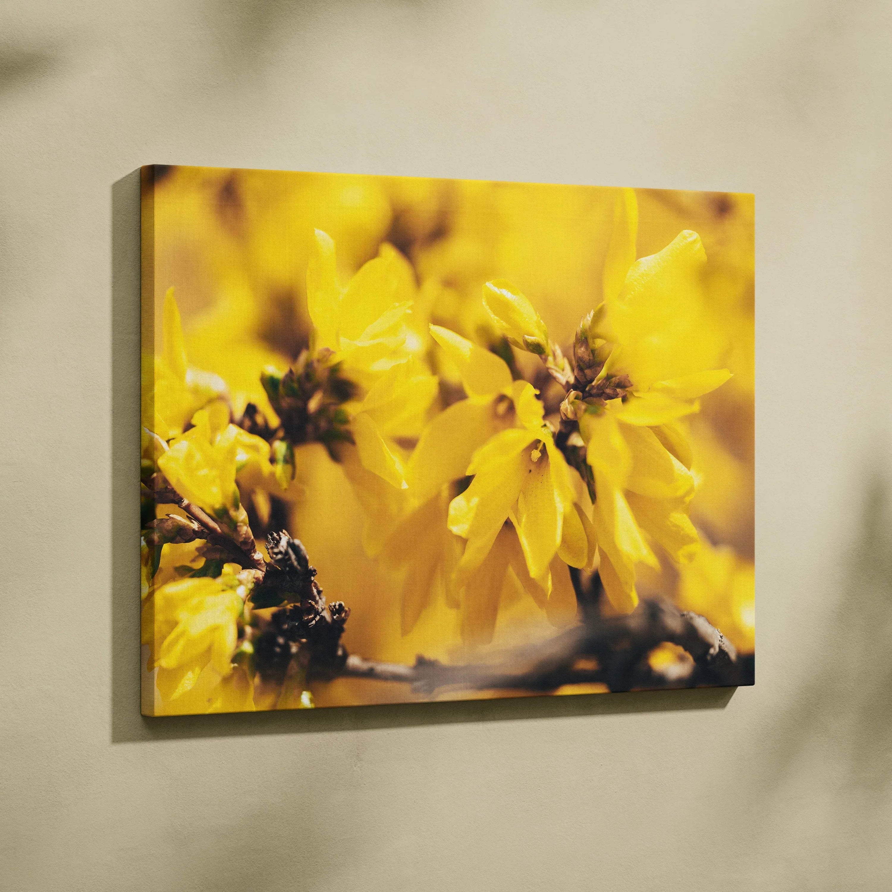 Yellow floral canvas wall art with close-up petals and green stems decor.
