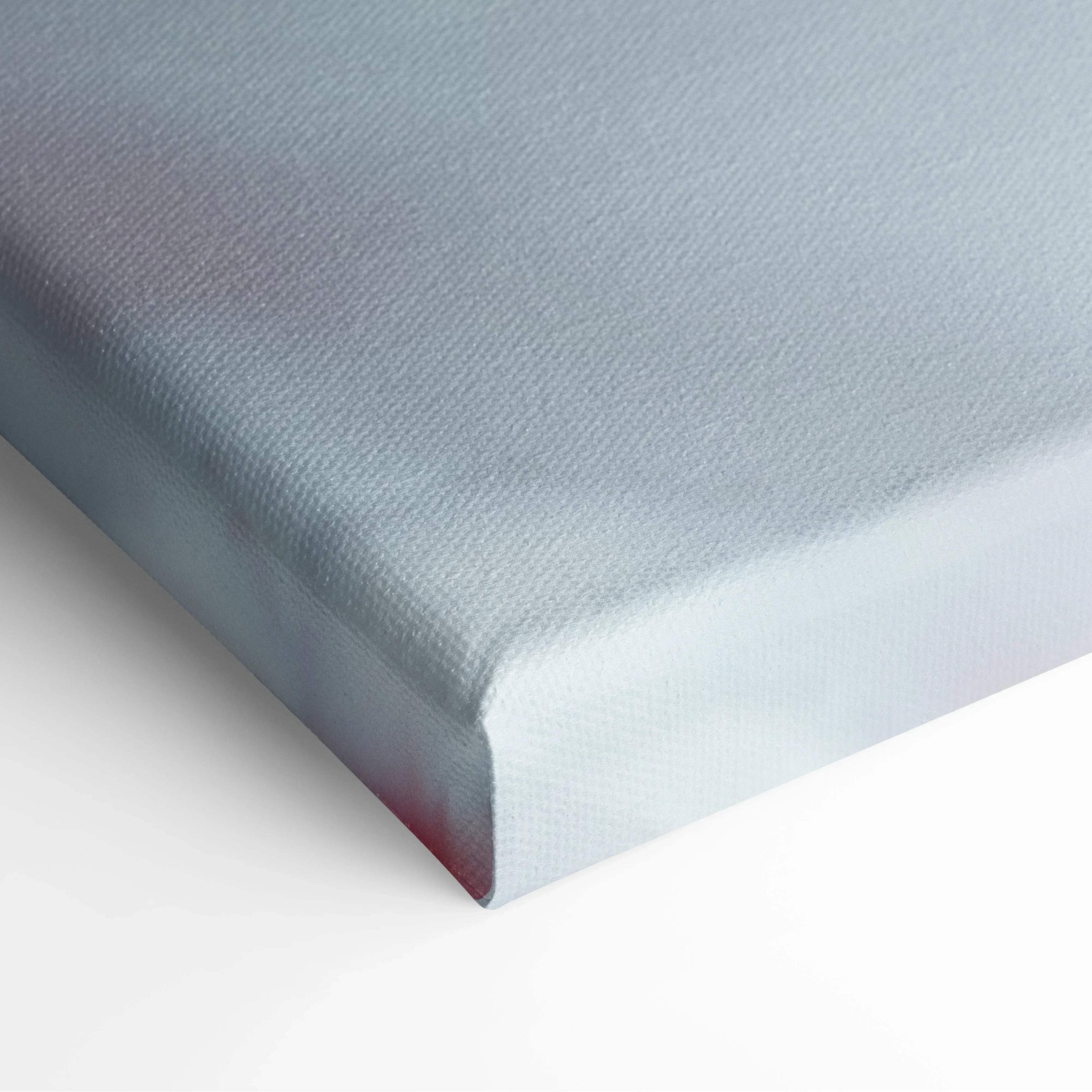 Close-up of white stretched canvas corner with crisp edges, showcasing smooth texture for wall art decor.