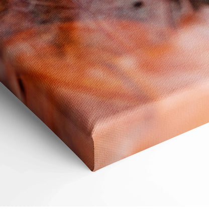 Close-up of vibrant autumn landscape canvas wall art with rich orange and brown hues.