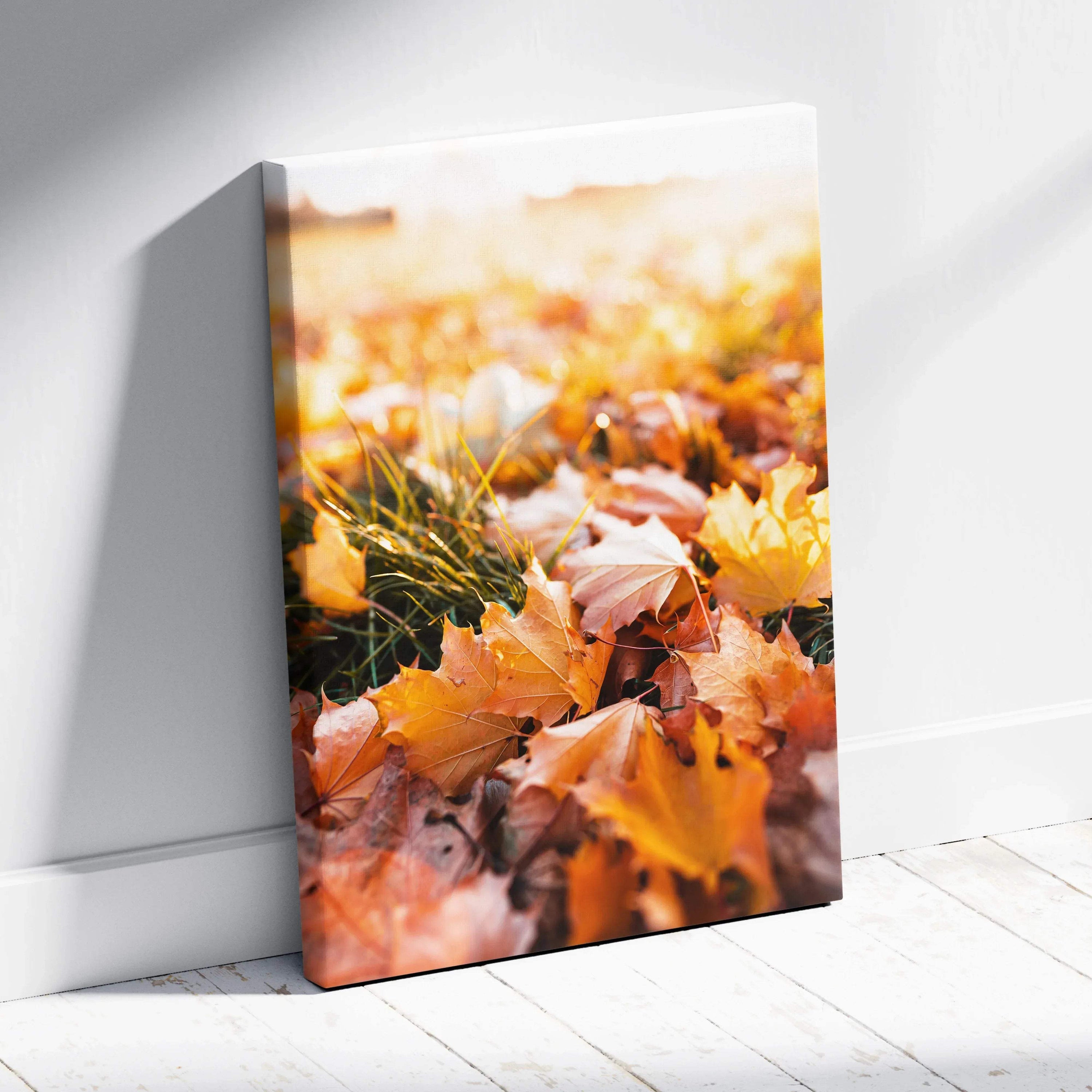 Vertical canvas wall art featuring vibrant autumn leaves in warm orange and yellow tones, nature-inspired wall art.