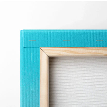 Turquoise canvas edge with visible wood frame and stapled backing layer for wall art canvas art.