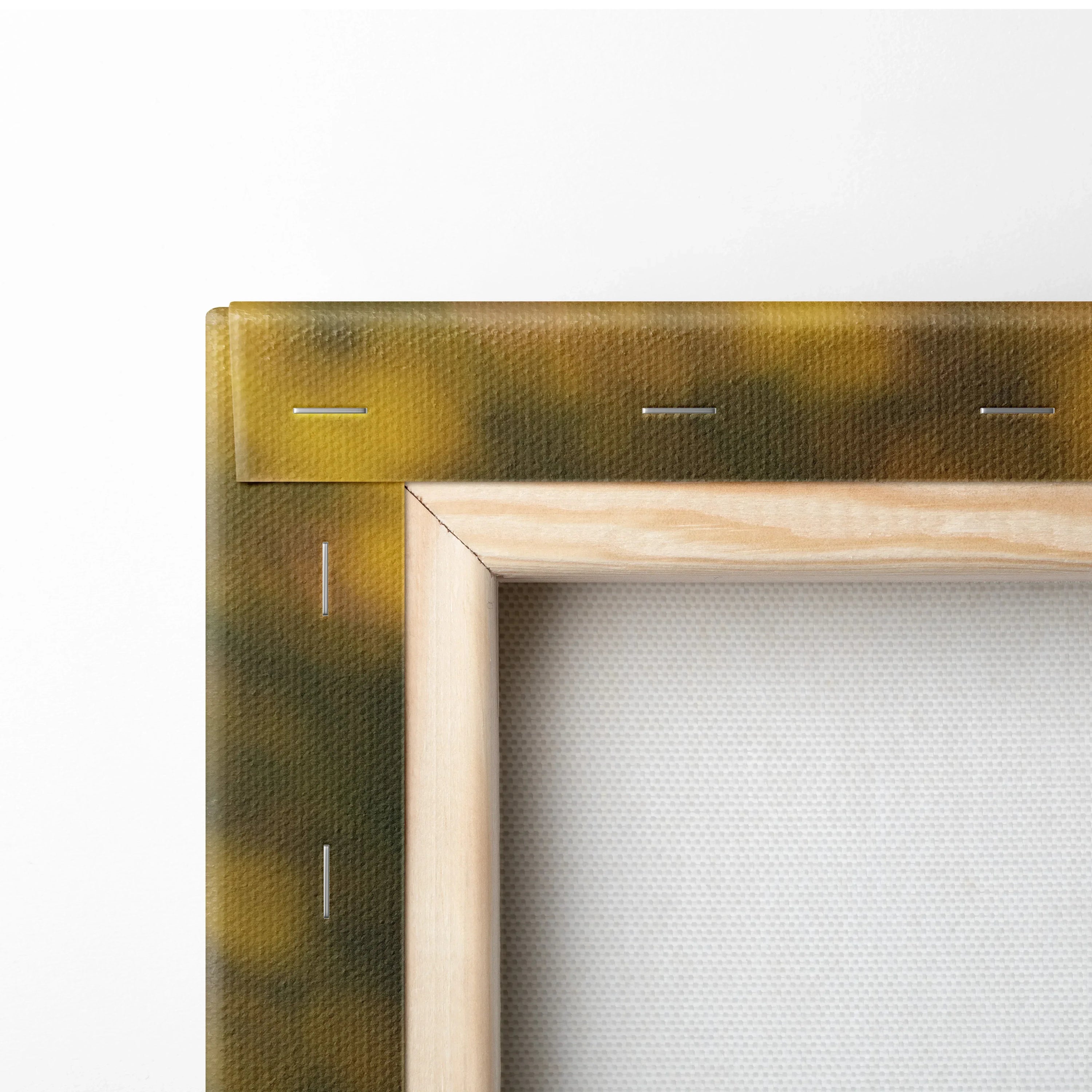 Close-up of wooden framed canvas showing canvas texture and stapled edges for wall art decor.