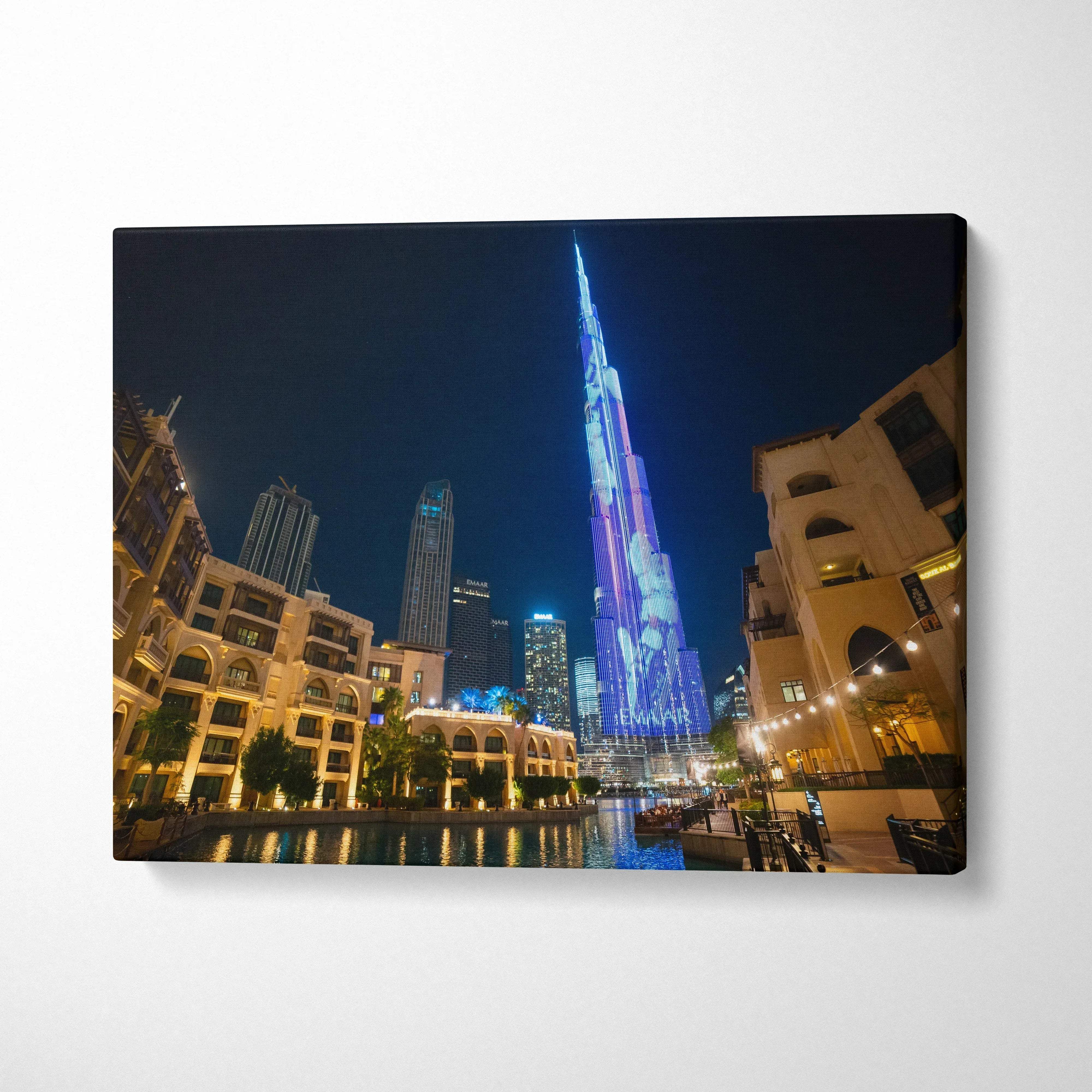 Canvas wall art featuring high-resolution digital art of illuminated modern skyscrapers at night.