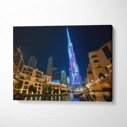 Canvas wall art featuring high-resolution digital art of illuminated modern skyscrapers at night.