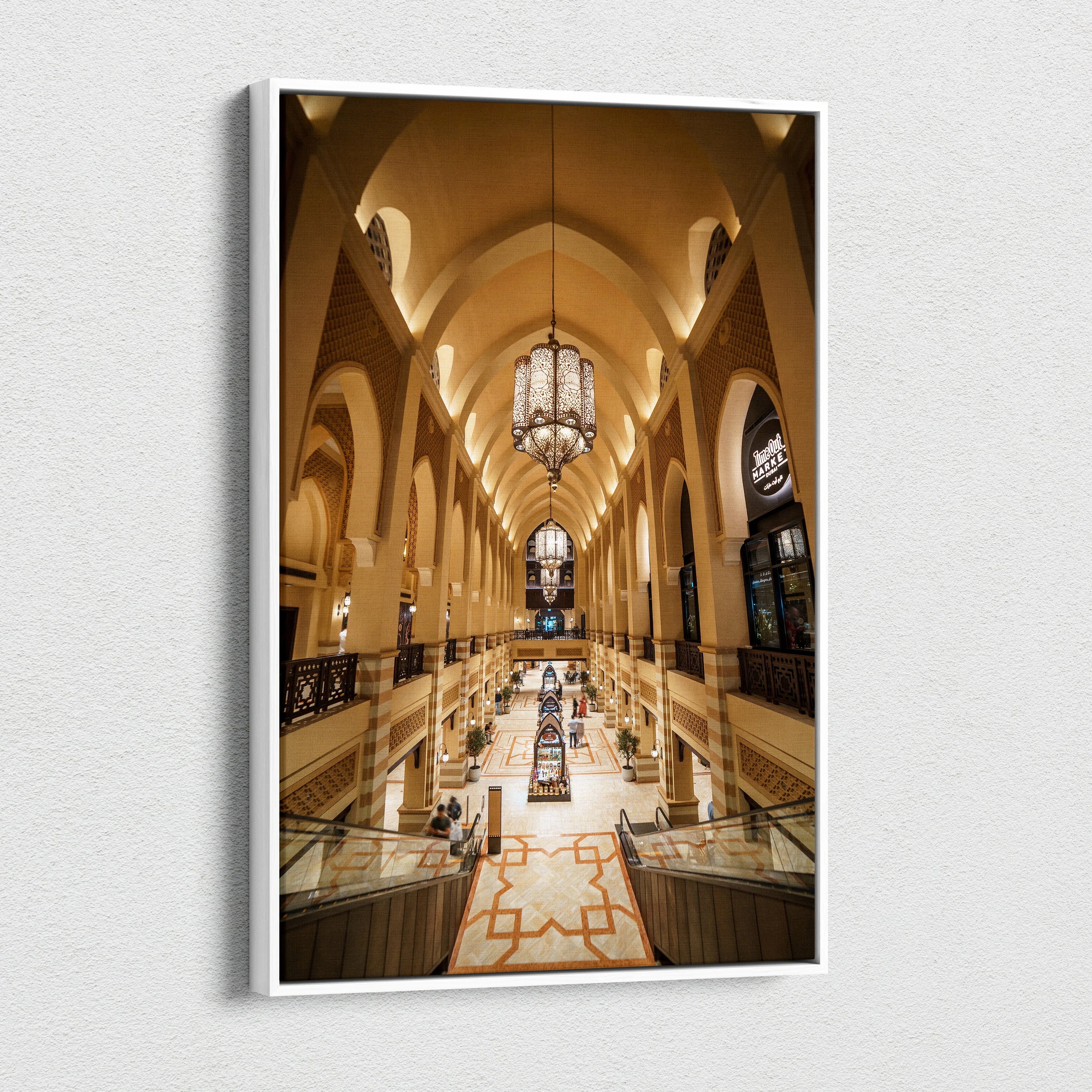 Vertical canvas art print of a grand architectural interior with beige arches, hanging chandeliers, and patterned floor.