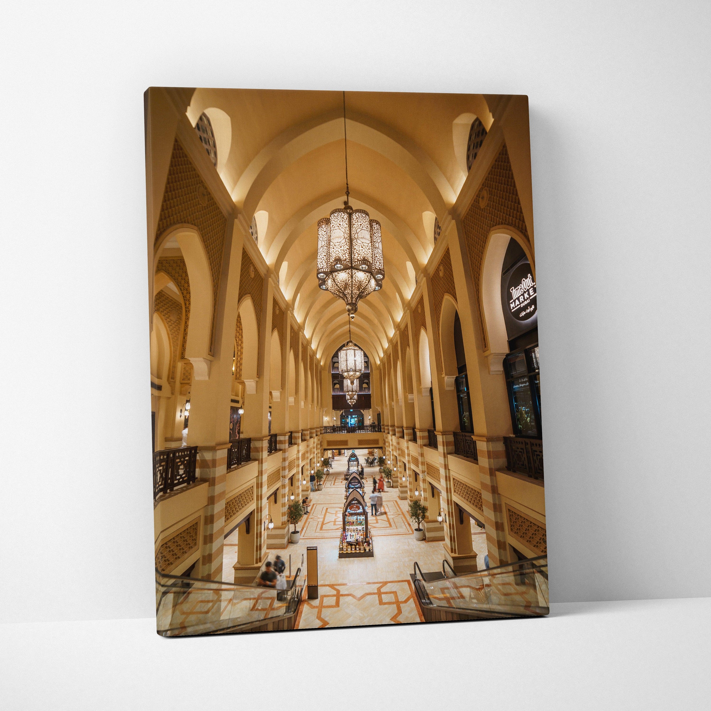 Warm-toned canvas wall art print of a grand, arched architectural interior with hanging chandeliers and detailed columns.